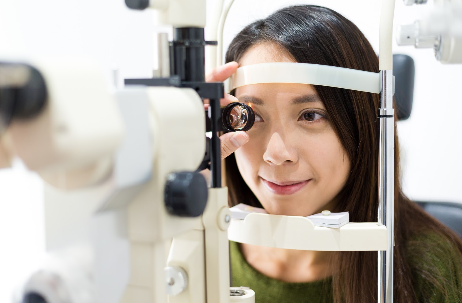 Young women undergoing eye exam from optometrist