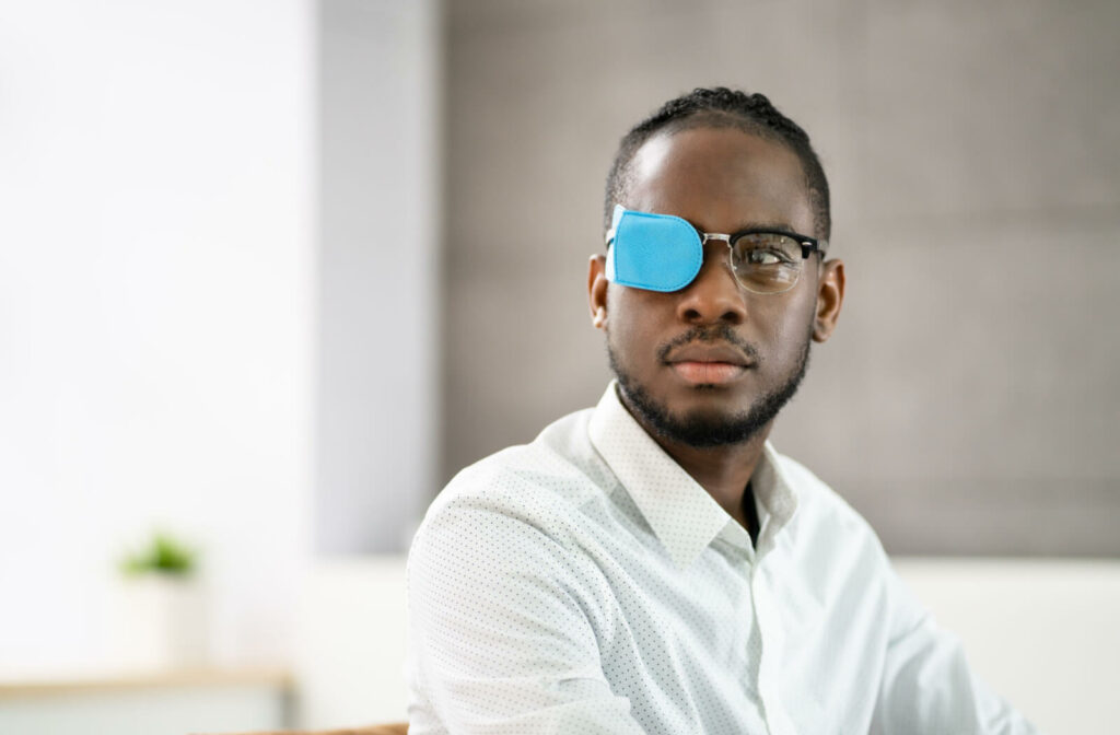 a man wears a blue eyepatch in an attempt to correct his lazy eye